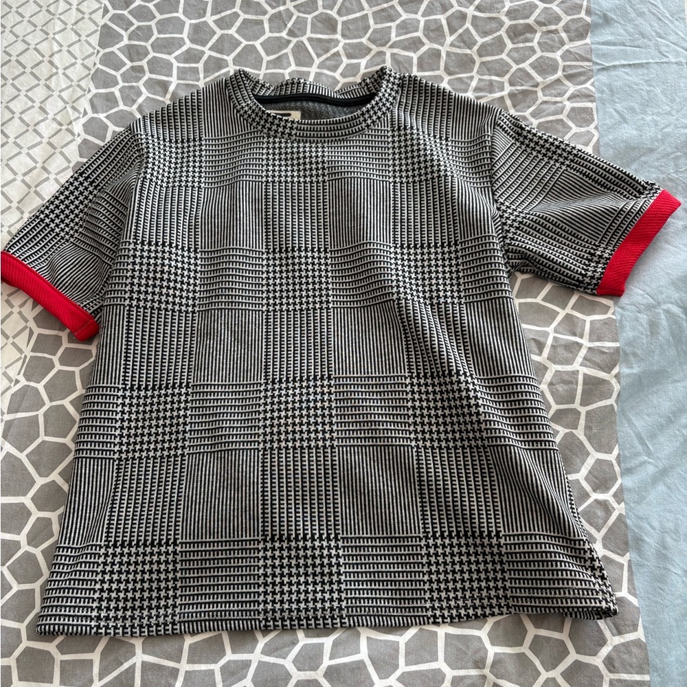 Stylish Black and White Plaid T-Shirt with Red Accents